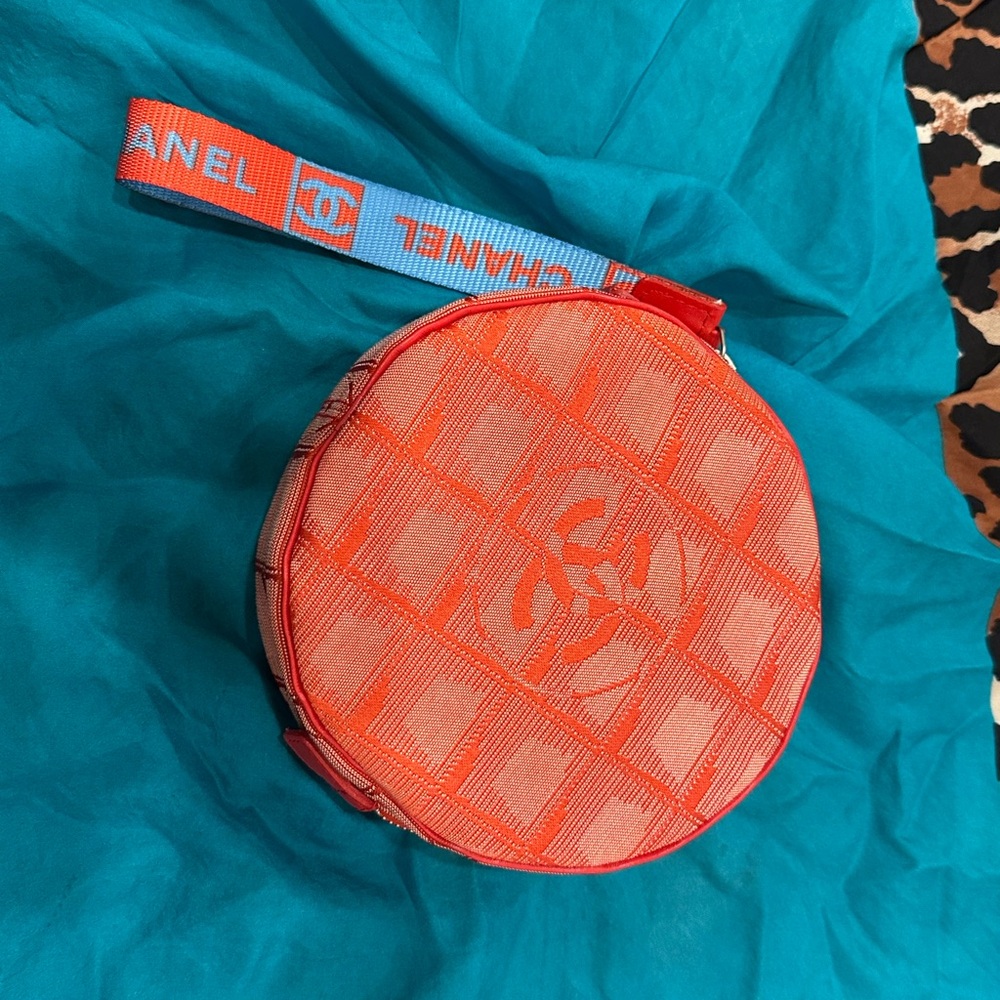 CHANEL Orange Round Logo Wristlet Pouch with Blue Accent Strap